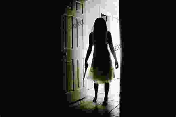 A Photograph Of A Woman Standing In A Dark Room, Her Face Hidden In The Shadows A Monster In The Bedroom