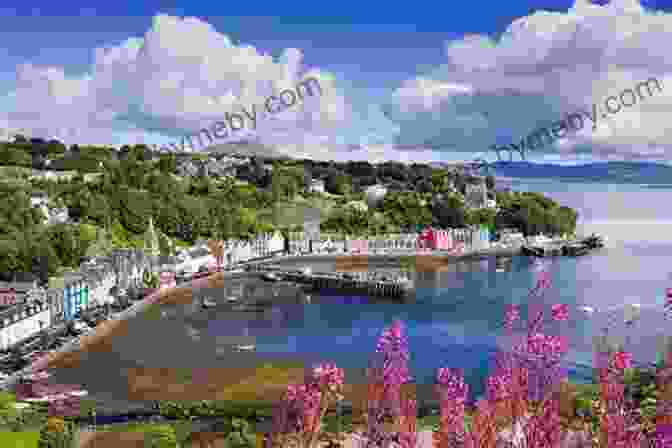 Stunning View Of The Inner Hebrides, Featuring A Lush Green Island, Crystal Clear Waters, And Snow Capped Mountains Scotland The Best The Islands