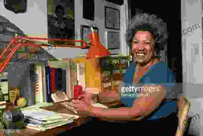 Toni Morrison, A Renowned Author, Seated At A Desk Writing Sula Toni Morrison